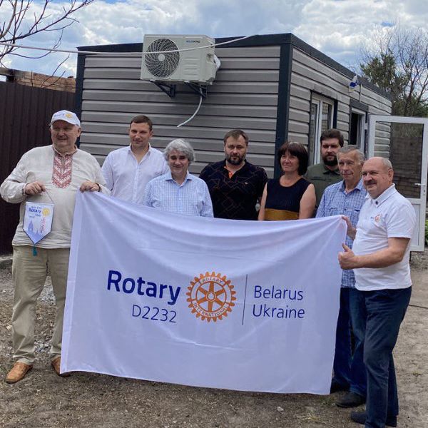 Local Rotarians pictured with one of the 124 temporary modular homes that have helped to house residents of Moshchun, a village near the Ukrainian capital, where Russian bombardment destroyed or severely damaged 70% of the buildings. 

Their appeal to other Rotary clubs brought support from 12 countries including Britain. Our Ukrainian Quiz Night, held in November, raised funds for furniture and other household essentials.